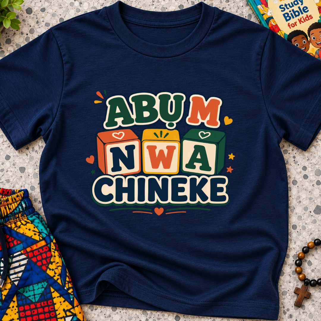 Abụ M Nwa Chineke Igbo Christian kids shirt in navy blue featuring colourful block lettering and decorative accents
