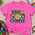 Abụ M Nwa Chineke Igbo Christian kids shirt in pink featuring colourful block lettering and decorative accents
