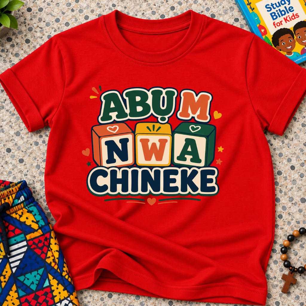Abụ M Nwa Chineke Igbo Christian kids shirt in red featuring colourful block lettering and decorative accents
