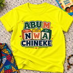 Abụ M Nwa Chineke Igbo Christian kids shirt in yellow featuring colourful block lettering and decorative accents
