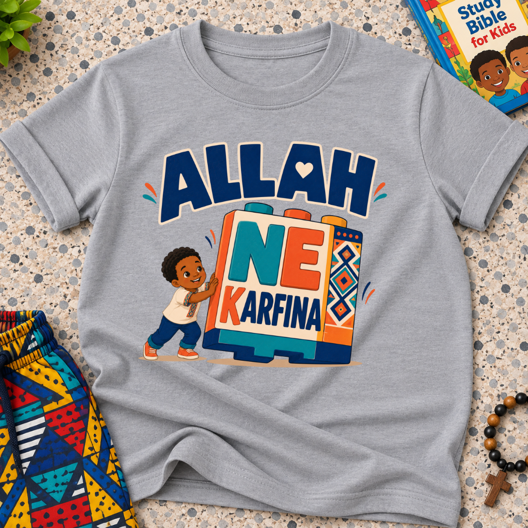 Allah Ne Ƙarfina Hausa-language kids shirt in grey featuring bold lettering and a child beside colourful blocks
