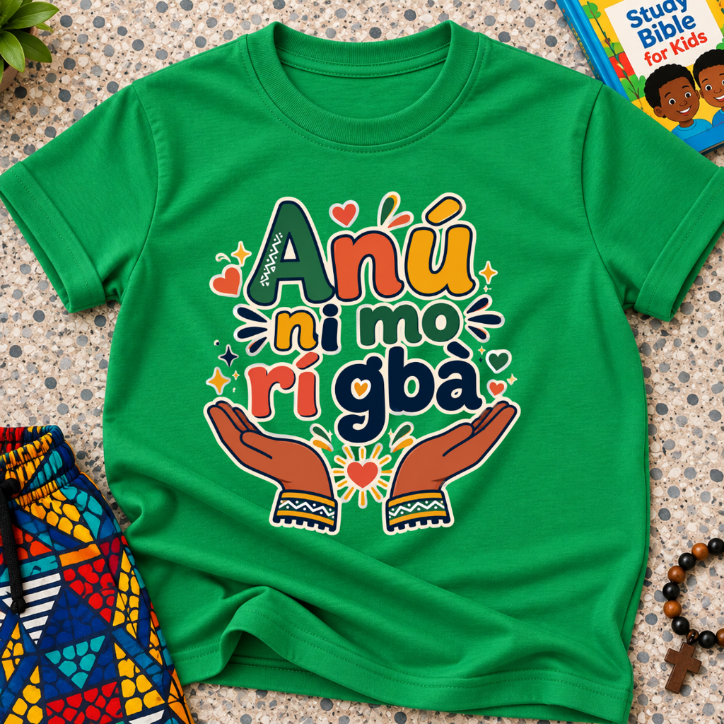 Anụ Ni mo ri Gba kids shirt in green featuring colourful lettering, raised hands, and decorative artwork
