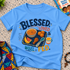 Blessed Loved and Well Fed Christian kids shirt in light blue featuring colourful food and family-inspired artwork
