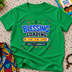 Blessing Loading Christian kids shirt in green featuring a colourful progress bar and God Is Not Finished Yet message
