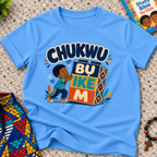 Chukwu Bụ Ike M Igbo Christian kids shirt in light blue featuring bold lettering and a child beside colourful blocks
