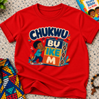 Chukwu Bụ Ike M Igbo Christian kids shirt in red featuring bold lettering and a child beside colourful blocks
