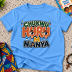 Chukwu Huru M N'anya Igbo Christian kids shirt in light blue featuring bold colourful lettering and decorative artwork
