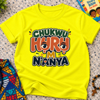 Chukwu Huru M N'anya Igbo Christian kids shirt in yellow featuring bold colourful lettering and decorative artwork

