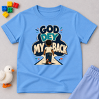 God Dey My Back Christian kids shirt in light blue featuring a child illustration and bold Nigerian Pidgin faith message
