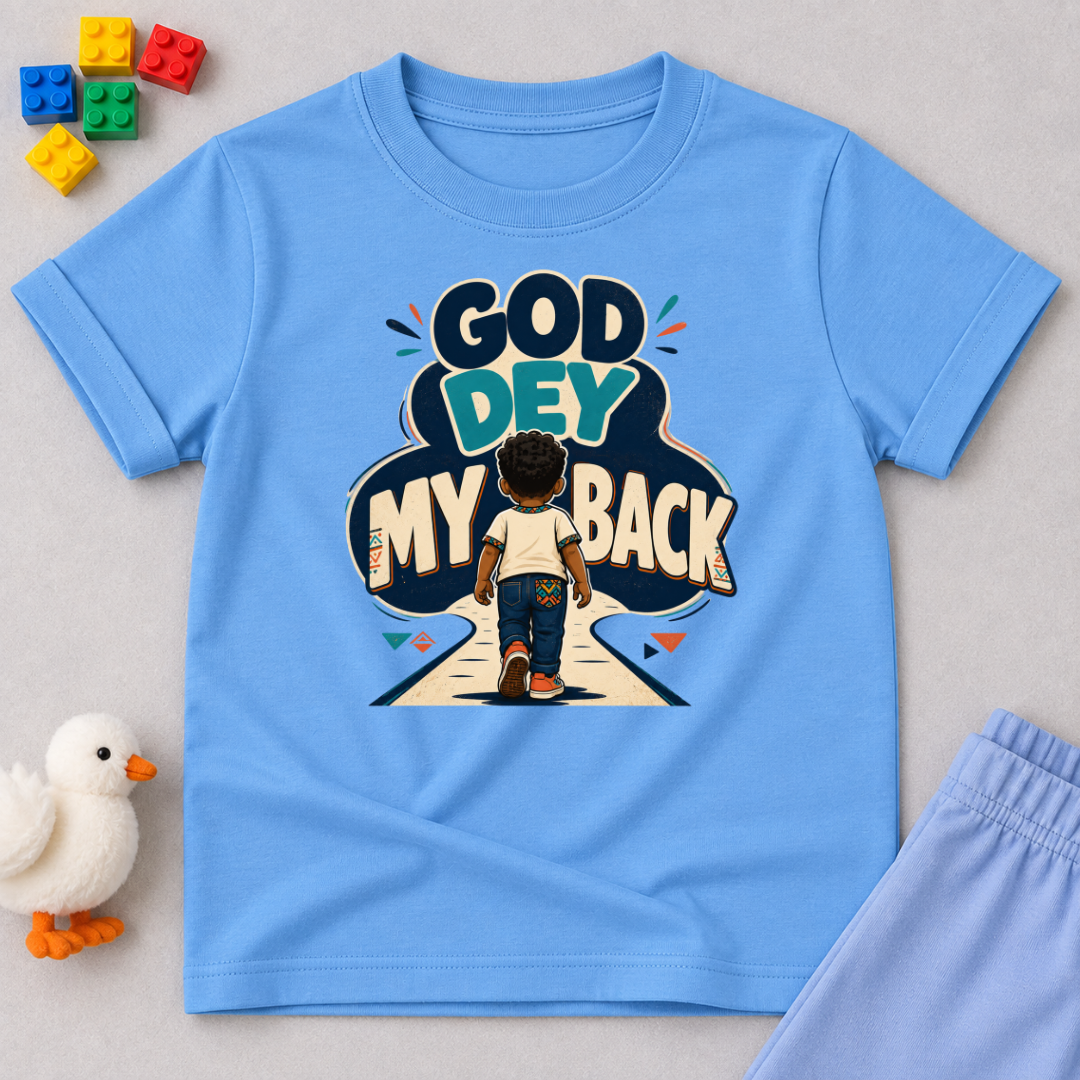 God Dey My Back Christian kids shirt in light blue featuring a child illustration and bold Nigerian Pidgin faith message
