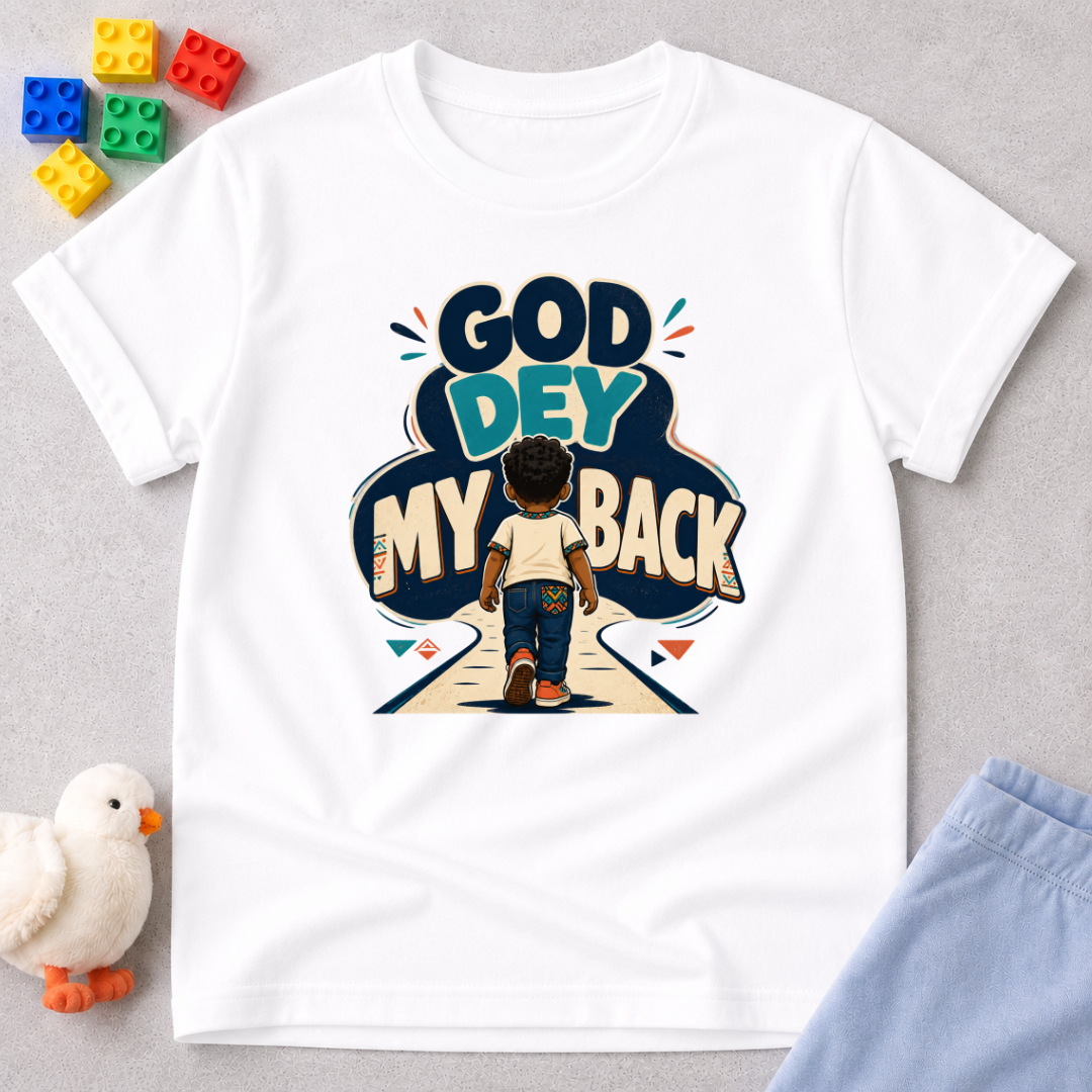 God Dey My Back Christian kids shirt in white featuring a child illustration and bold Nigerian Pidgin faith message
