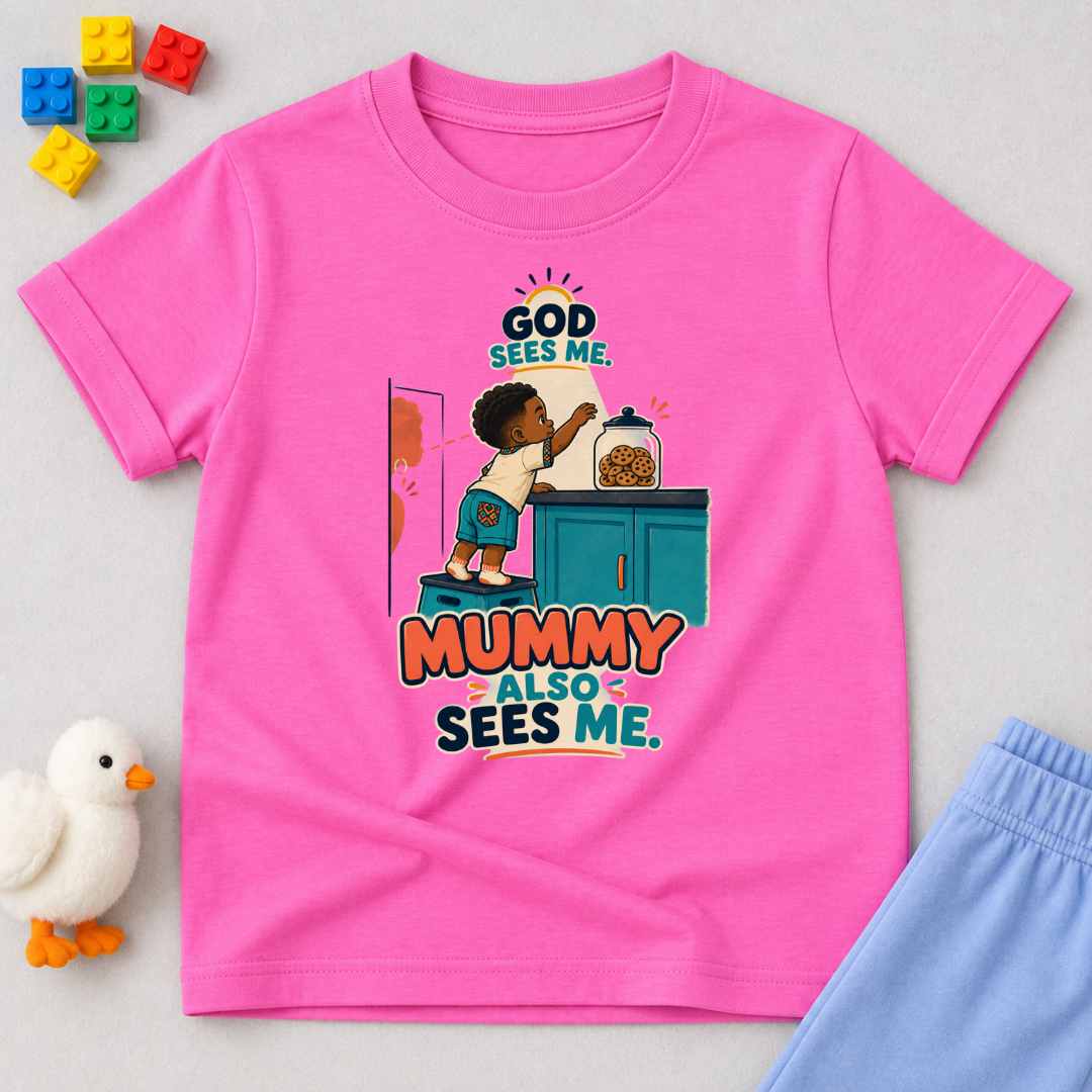God Sees Me Mummy Also Sees Me Christian kids shirt in pink featuring a child illustration and playful parenting message
