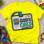 God's Child Christian kids shirt in yellow featuring a colourful travel case design and faith-inspired details
