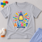 I Am a Light Christian kids shirt in light grey featuring a lantern, colourful rays, and Matthew 5:14
