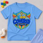I Am Covered Christian kids shirt in light blue featuring a shield design, cross, and God Is With Me message
