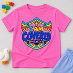 I Am Covered Christian kids shirt in pink featuring a shield design, cross, and God Is With Me message
