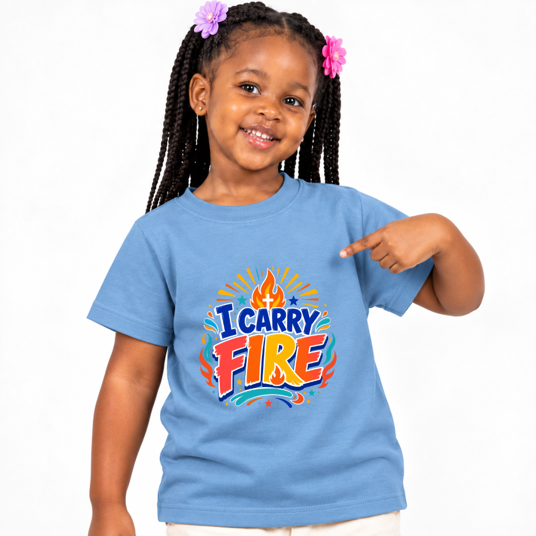 I Carry Fire Christian kids shirt in light blue featuring bold lettering, flames, and a faith-inspired cross
