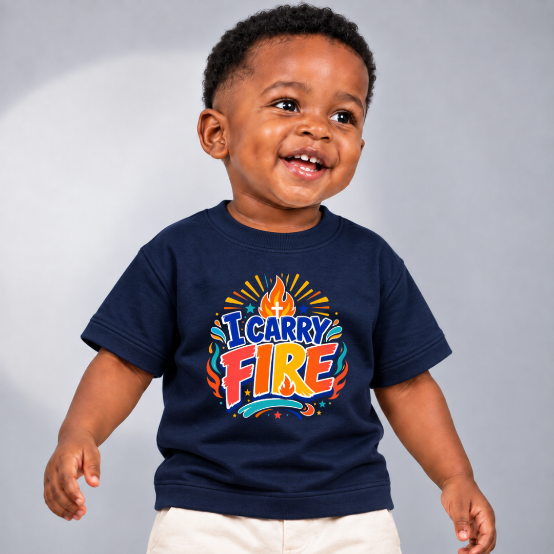 I Carry Fire Christian kids shirt in navy blue featuring bold lettering, flames, and a faith-inspired cross
