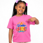 I Carry Fire Christian kids shirt in pink featuring bold lettering, flames, and a faith-inspired cross
