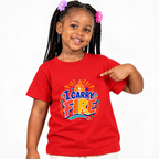 I Carry Fire Christian kids shirt in red featuring bold lettering, flames, and a faith-inspired cross
