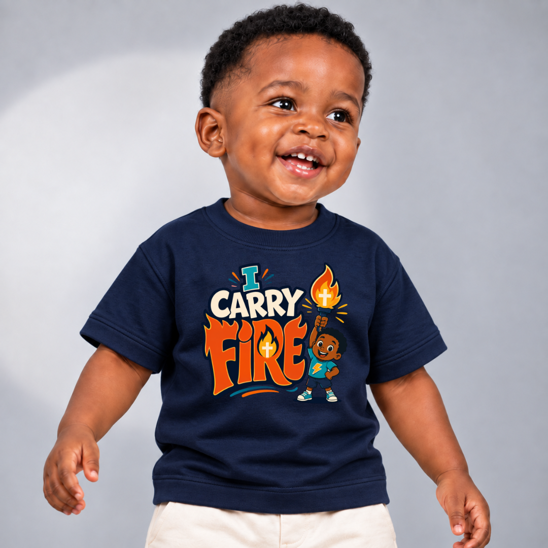 I Carry Fire Christian kids shirt in navy blue featuring an illustrated child holding a flaming torch
