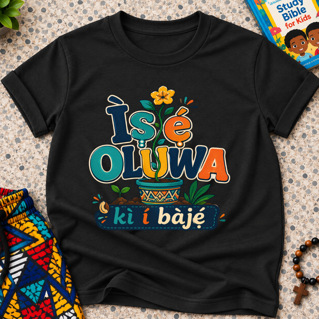 Ìṣẹ́ Olúwa Kì Í Bàjẹ́ Yoruba Christian kids shirt in black featuring colourful lettering and Nigerian-inspired decorative artwork
