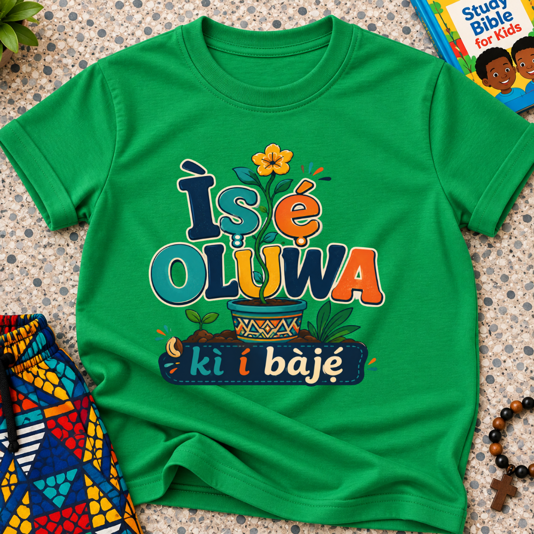 Ìṣẹ́ Olúwa Kì Í Bàjẹ́ Yoruba Christian kids shirt in green featuring colourful lettering and Nigerian-inspired decorative artwork
