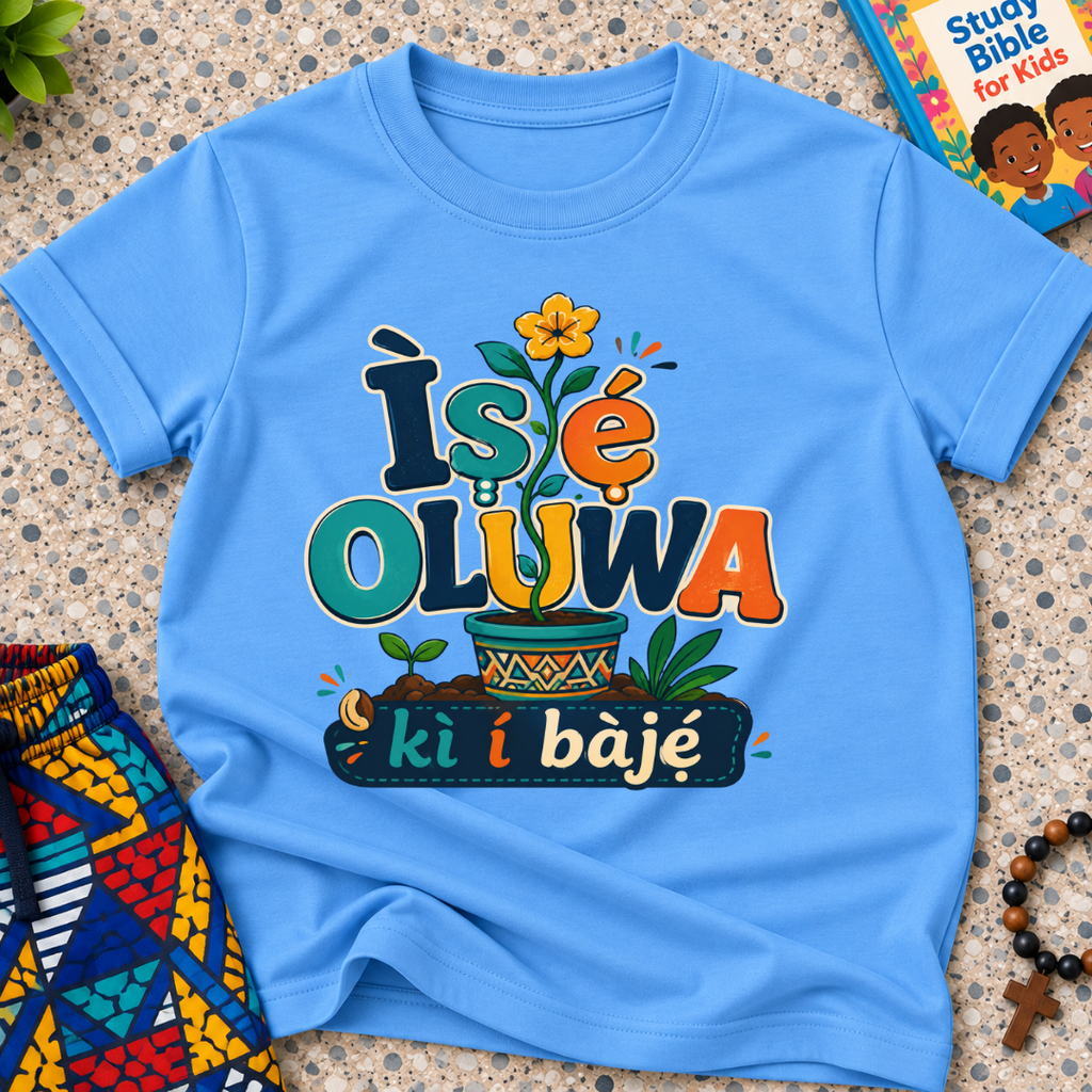 Ìṣẹ́ Olúwa Kì Í Bàjẹ́ Yoruba Christian kids shirt in light blue featuring colourful lettering and Nigerian-inspired decorative artwork

