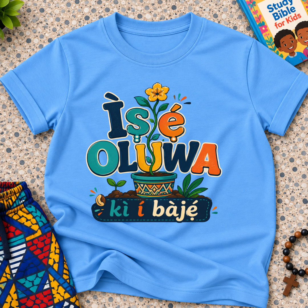 Ìṣẹ́ Olúwa Kì Í Bàjẹ́ Yoruba Christian kids shirt in light blue featuring colourful lettering and Nigerian-inspired decorative artwork
