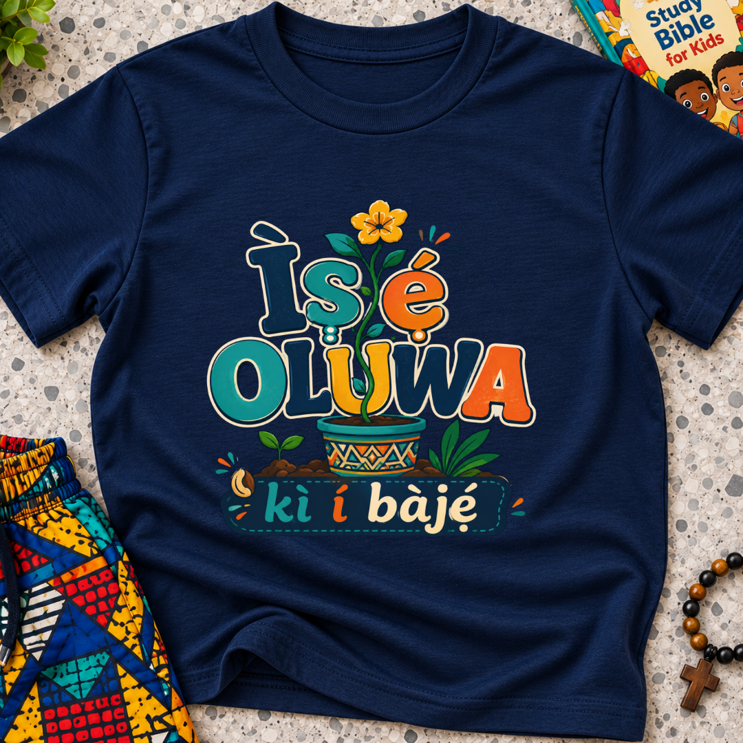 Ìṣẹ́ Olúwa Kì Í Bàjẹ́ Yoruba Christian kids shirt in navy blue featuring colourful lettering and Nigerian-inspired decorative artwork
