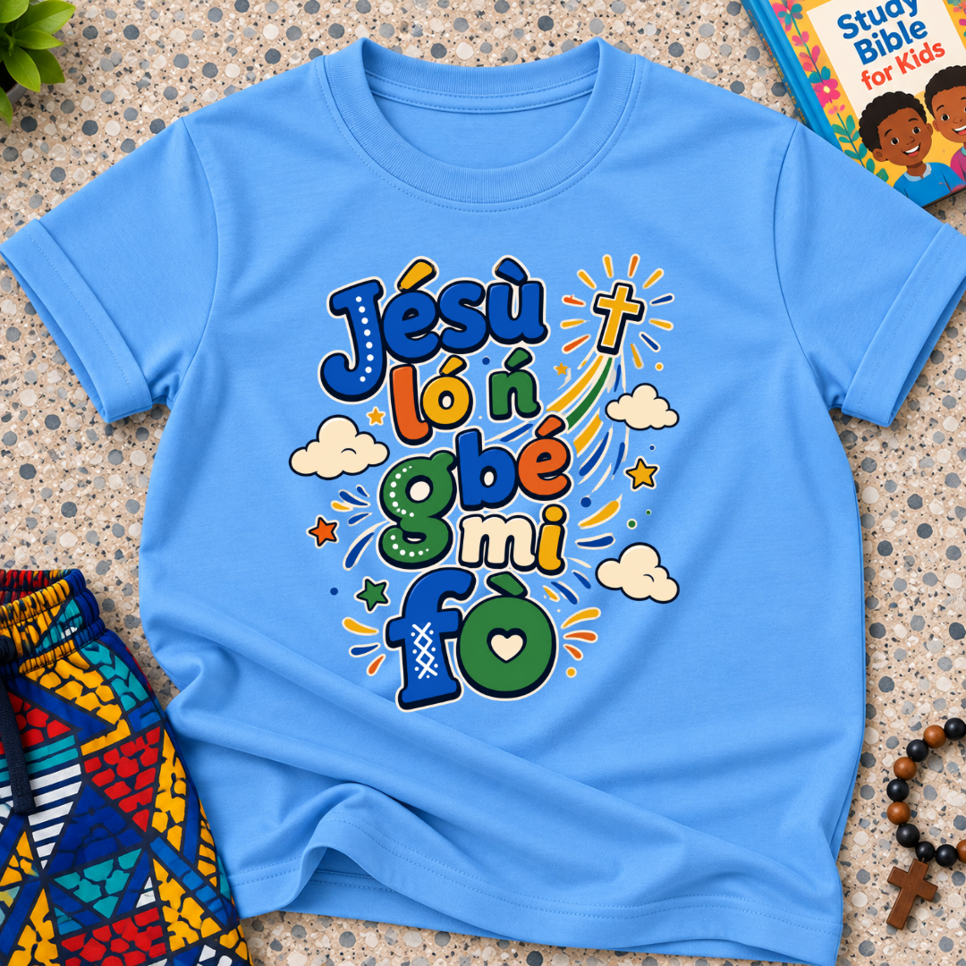 Jésù Lọ́n Gbẹ Mi Fọ Yoruba Christian kids shirt in light blue featuring colourful lettering, clouds, and star illustrations
