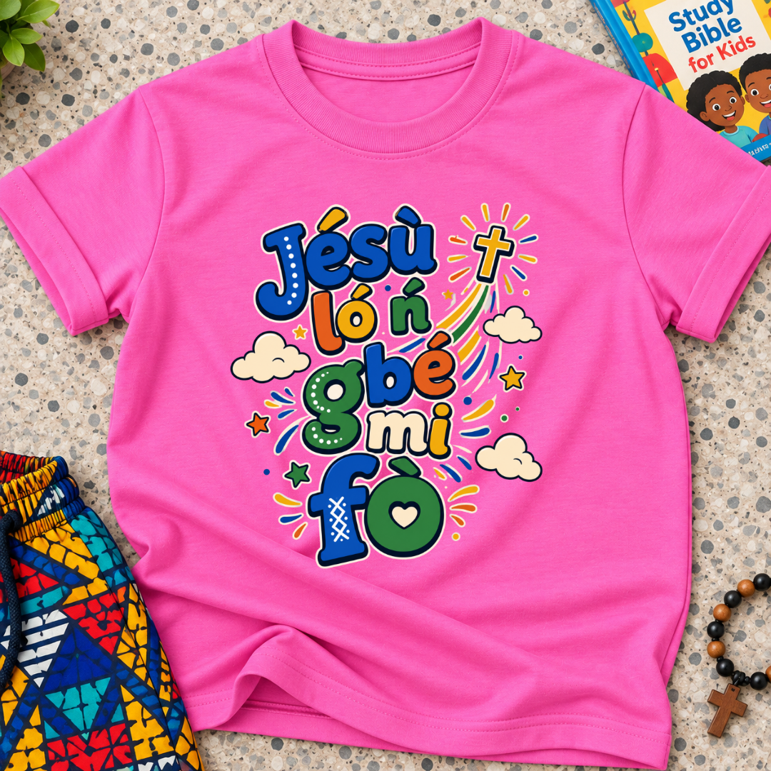 Jésù Lọ́n Gbẹ Mi Fọ Yoruba Christian kids shirt in pink featuring colourful lettering, clouds, and star illustrations
