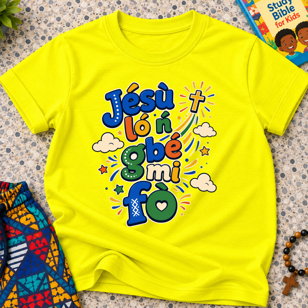 Jésù Lọ́n Gbẹ Mi Fọ Yoruba Christian kids shirt in yellow featuring colourful lettering, clouds, and star illustrations