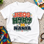 Jizọs Huru M N'anya Igbo Christian kids shirt in white featuring bold colourful lettering and decorative accents
