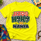 Jizọs Huru M N'anya Igbo Christian kids shirt in yellow featuring bold colourful lettering and decorative accents
