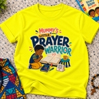 Mummy's Little Prayer Warrior Christian kids shirt in yellow featuring a child praying beside books and faith-inspired details
