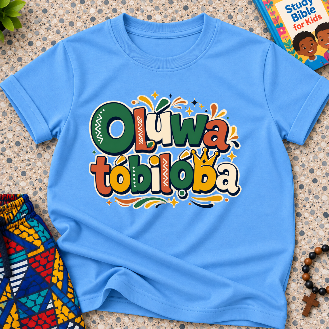 Oluwatobiloba Yoruba-inspired kids shirt in light blue featuring colourful oversized lettering and playful decorative artwork