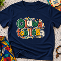Oluwatobiloba Yoruba-inspired kids shirt in navy blue featuring colourful oversized lettering and playful decorative artwork