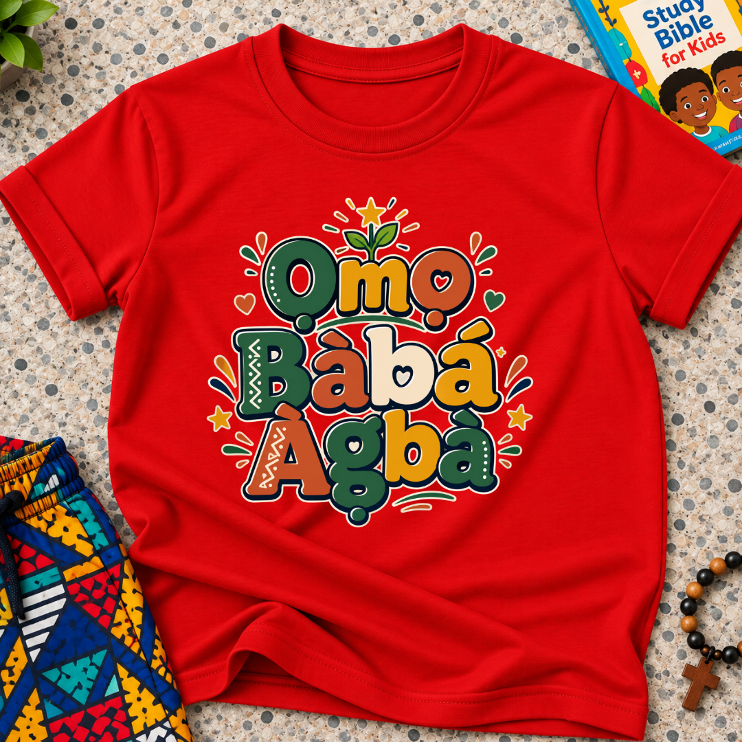 Ọmọ Bàbá Àgbà Yoruba-language kids shirt in red featuring colourful lettering, decorative leaves, and playful accents