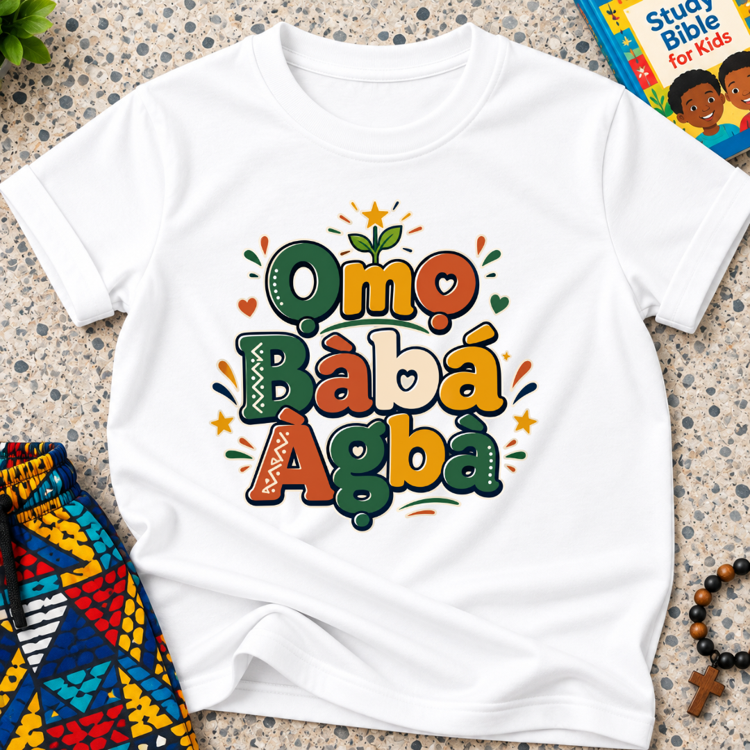 Ọmọ Bàbá Àgbà Yoruba-language kids shirt in white featuring colourful lettering, decorative leaves, and playful accents
