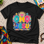 Ọmọ Jésù Yoruba Christian kids shirt in black featuring colourful lettering and playful faith-inspired decorations
