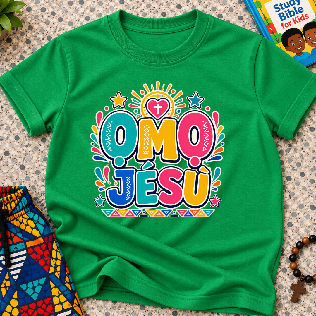 Ọmọ Jésù Yoruba Christian kids shirt in green featuring colourful lettering and playful faith-inspired decorations
