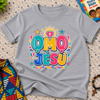 Ọmọ Jésù Yoruba Christian kids shirt in grey featuring colourful lettering and playful faith-inspired decorations
