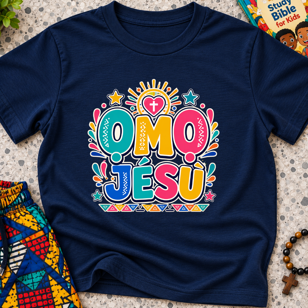 Ọmọ Jésù Yoruba Christian kids shirt in navy blue featuring colourful lettering and playful faith-inspired decorations
