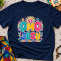 Ọmọ Jésù Yoruba Christian kids shirt in navy blue featuring colourful lettering and playful faith-inspired decorations
