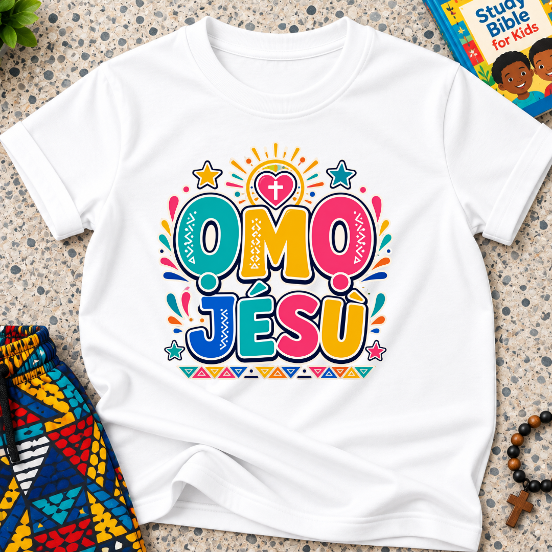 Ọmọ Jésù Yoruba Christian kids shirt in white featuring colourful lettering and playful faith-inspired decorations
