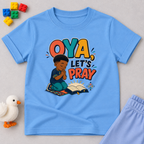 Oya, Let's Pray Christian kids shirt in light blue featuring a child praying and a colourful Nigerian Pidgin-inspired message
