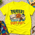 Prayers Before Puff Puff Christian kids shirt in yellow featuring puff puff and Nigerian food-inspired artwork
