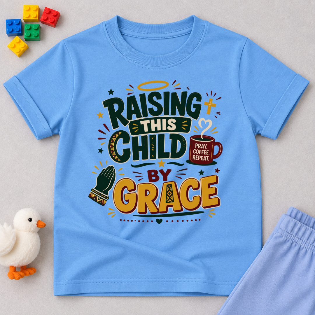 Raising This Child by Grace Christian kids shirt in light blue featuring warm typography and playful parenting-themed artwork
