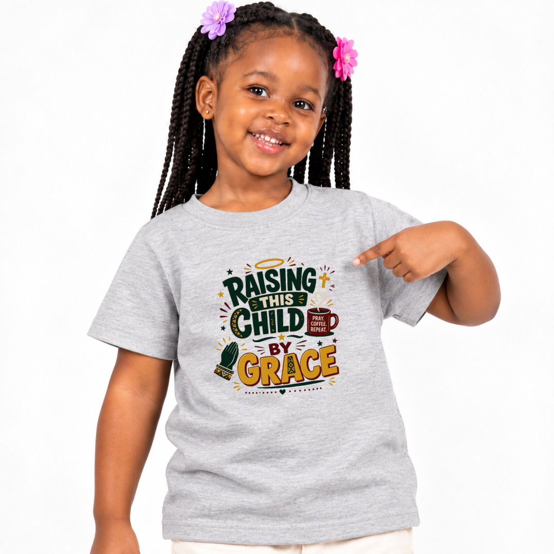 Raising This Child by Grace Christian kids shirt in light grey featuring warm typography and playful parenting-themed artwork
